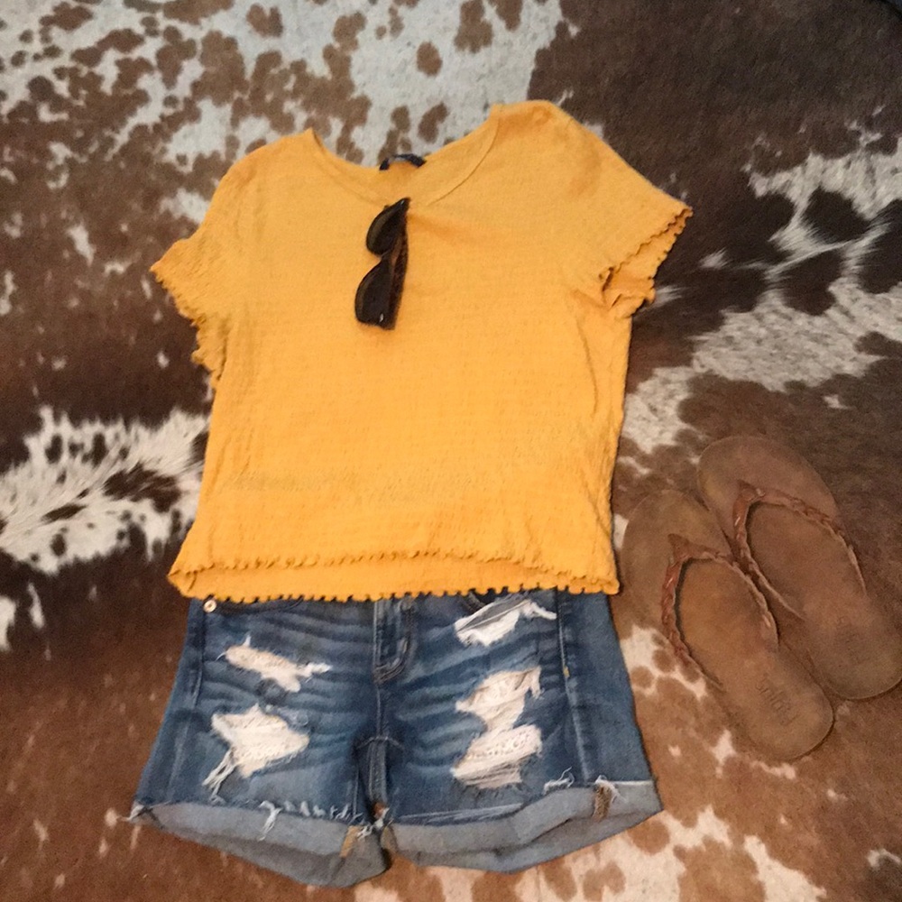 Yellow and burnt orange shirts